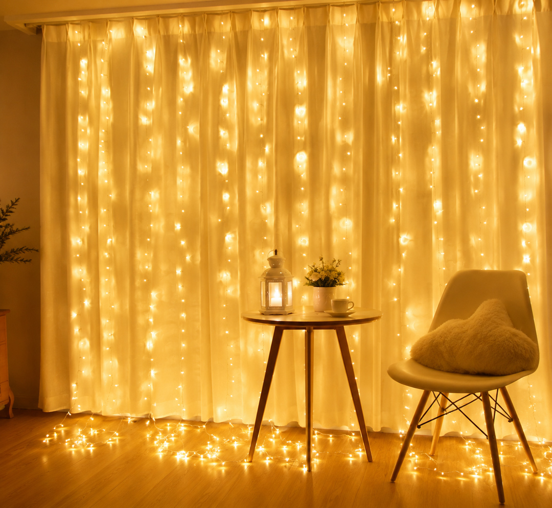 warm-white-led-curtain-lights.jpg ستارة LED وورم 3 متر | 12 فرع ليد مع 8 أوضاع إضاءة للديكور والمناسبات - الصورة 1