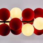 Modern chandelier with red and white spheres, featuring a contemporary design. - Image 2